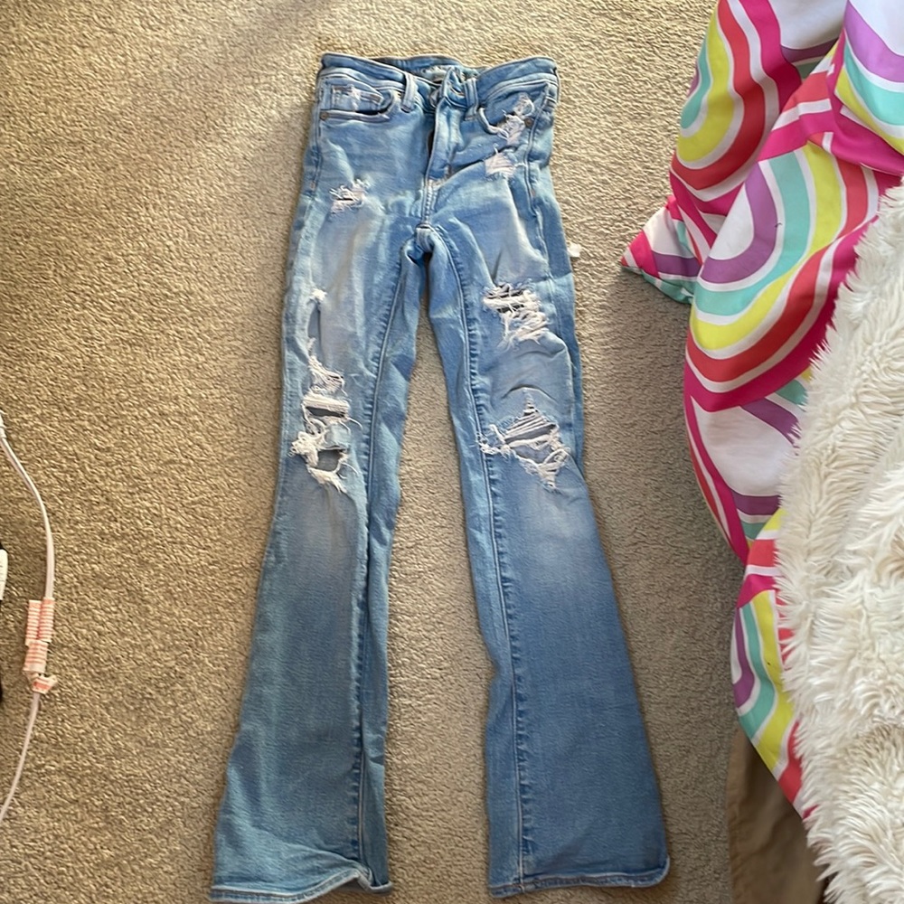 ripped bell bottom jeans from american eagle